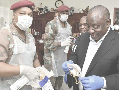 South African President Cyril Ramaphosa (right) is receiving the necessary Covid-19 package to protect himself and those around him