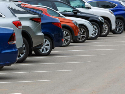 Brand-new export cars lined up in a parking lot, ready for shipment