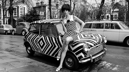 1960s Mod fashion, short for "modernist," was a youth-driven style revolution that emerged from Swinging London. Rejecting the conservative and austere fashions of the 1950s, it embraced bold colour blocking, geometric patterns, sleek shift dresses, miniskirts, and iconic go-go boots, creating a fresh and distinctly modern aesthetic