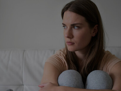 A woman navigates anxiety and depression in the comfort of her home, embodying resilience and inner strength