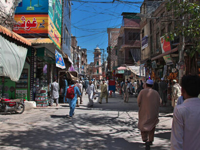 The vibrant local market in Peshawar, Pakistan, teeming with life and culture