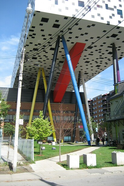 Designed by architect Will Alsop, the building is elevated on colorful stilts and features a striking pixelated façade, Canada