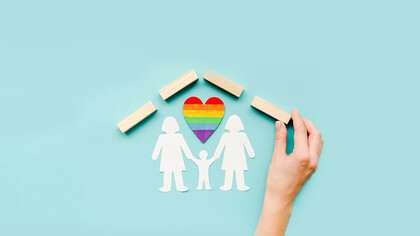 A composition representing the concept of LGBTQ+ families, set against a blue background