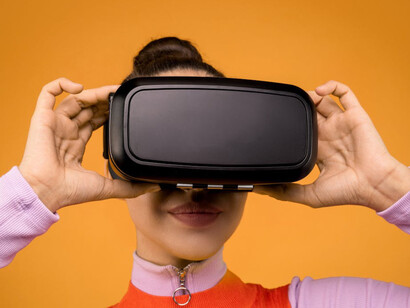 Immersed in a virtual world with VR goggles, she's experiencing firsthand how AI is revolutionising the way we interact with entertainment