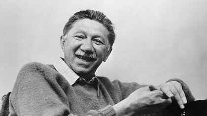Abraham Maslow, smiling at the camera