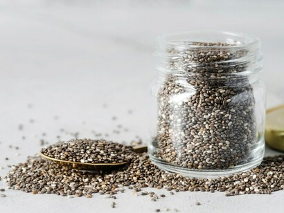 A jar filled with chia seeds, representing ancient superfoods, sustainable agriculture, and traditional diets