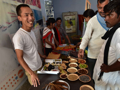 North East Network member with food diversity display, at Food Confluence, Bikaner, Rajasthan, Western India © Ashish Kothari