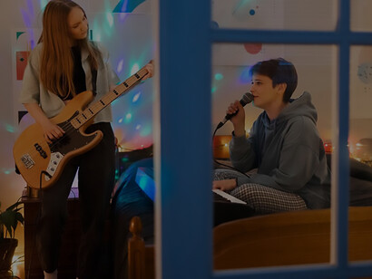 Friends joyfully making music at home: a heartwarming glimpse into the happy world of teenage camaraderie and musical collaboration