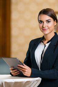 A woman working in the hospitality and tourism sector overseas