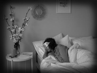 A woman sleeping with a mask to block out light while sleeping