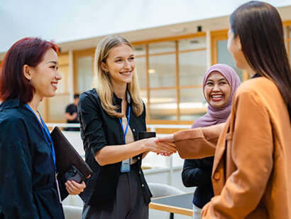 A bilateral meeting between businesswomen highlights the enduring role of classical diplomacy in modern professional settings