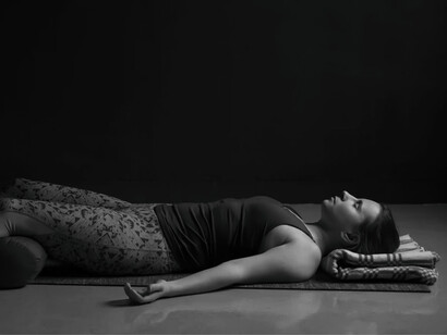 A woman practices holotropic breathwork on her own