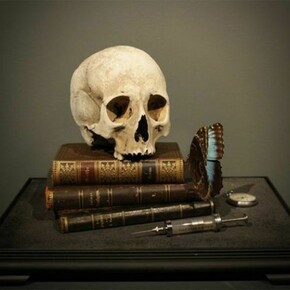 Dr.Viktor Schroeder, Memento Mori with 17th Century skull, 2013, 17th Century human skull, 19th Century books, antique pocket watch, Victorian syringe and blue butterfly, 35 x 44 x 32 cm