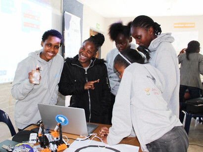 Girls at a coding camp in Mpumulanga, South Africa, diving into the world of technology, contributing to the nation's journey towards economic growth and social inclusion