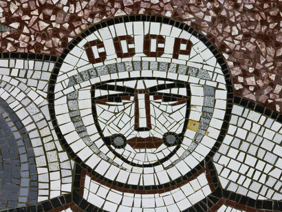 Close up of a Soviet-era mural of a cosmonaut