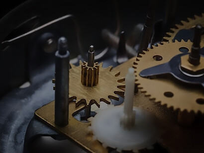 A detailed examination of the clock's inner workings on a macro scale, unveiling the intricate dance of cogs and gears that harmoniously choreograph the measurement of time