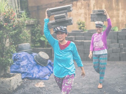 Women moving with bricks
