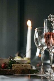 Glasses set on a banquet table alongside carefully curated pairings