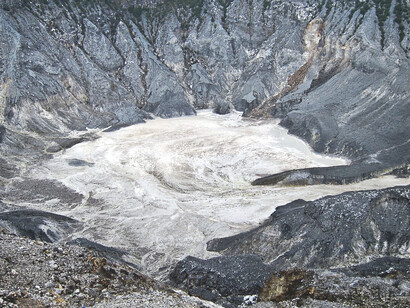 At the summit of Tangkuban Perahu in Bandung, Indonesia, the view of the steaming craters and the surrounding mountain range is both awe-inspiring and humbling, as nature’s raw beauty takes center stage
