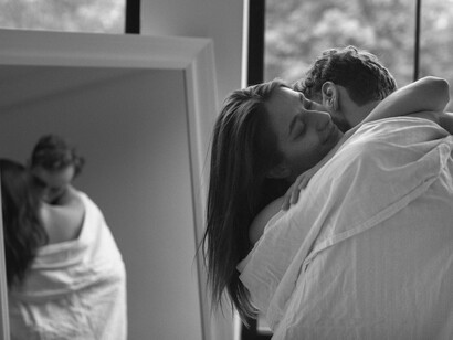 In the hush of an unspoken moment, where arms entwine, love exists in the fragile pauses between words, just as poetry breathes between the lines