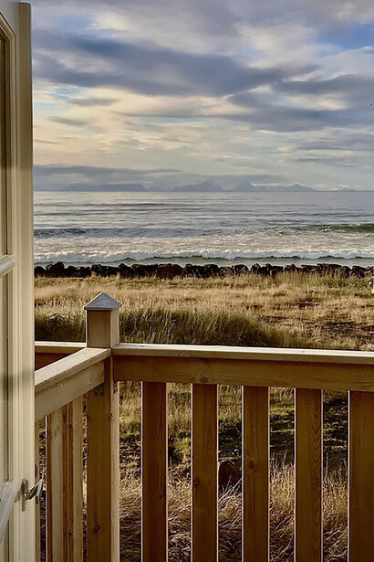 Listening to the waves of the North Atlantic break on the nearby shore 