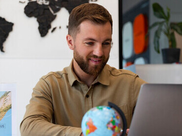 A day in the office of a multinational corporation reveals how global business and international trade fuel economic growth, technology, and investment through key trade agreements