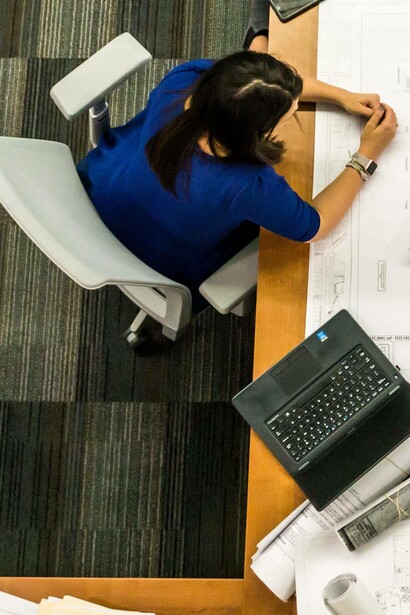 Woman discusses ideas with Monitoring and evaluation team