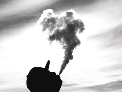 A large cloud of smoke after taking a vape hit