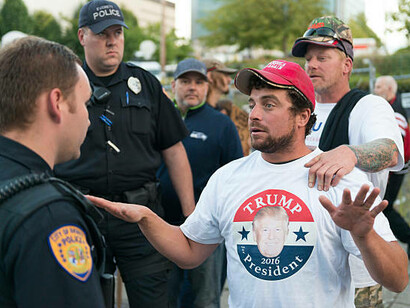 A Trump supporter clashes with law enforcement during a protest