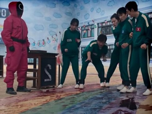 A game of Biseokchigi: with trembling hands and bound legs, a player must hit a stone from a distance—each strike a test of aim and desperation