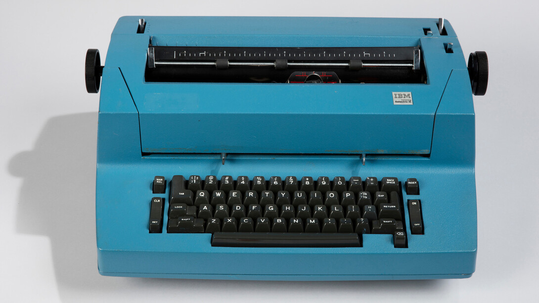 CORRECTING SELECTRIC II, MODEL 895 TYPEWRITER AND TYPING ELEMENTS; 1973; Designed by Eliot Noyes (American, 19101977); Manufactured by IBM (Armonk, New York, USA); Aluminum, steel, molded plastic; typewriter: 18 × 51 × 38 cm (7 1/16 × 20 1/16 × 14 15/16 in.); typing element (each): Diam. 3.8 cm (1 1/2 in.); Gift of Robert M. Greenberg, 2017-51-10-a/g