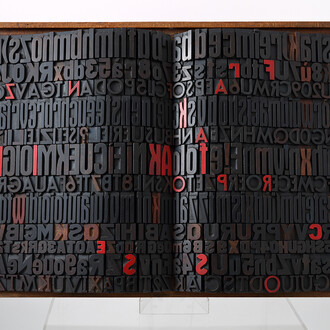Giorgio Milani, Kafka. Il processo, 2002, assemblaggio di caratteri tipografici di legno, cm. 57x81x10