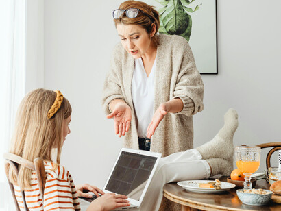 A stern conversation between a mother and her daughter, symbolising the pressure to always comply
