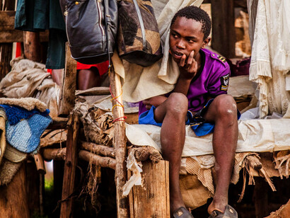 Each moment of contemplation carries the hope that one day, the boy will rise above the constraints of poverty