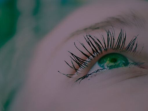 Delve into the intricacies of perception, perspective, and human senses with a close-up photograph capturing a young woman's eyes