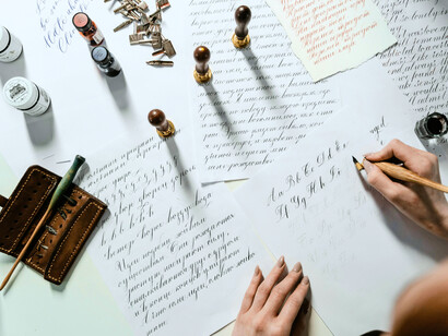 A hand shaping sentences, mirroring the choice to keep writing even when no one else was listening