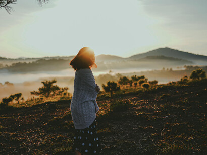 Dalat, Lâm Đồng, Vietnam woman standing on a mountain overlooking the scenery