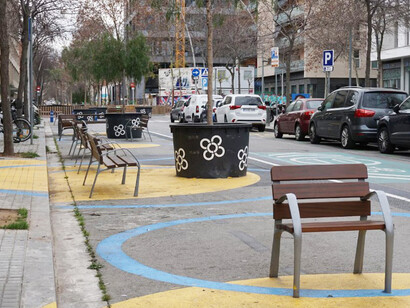 A park bench situated along the roadside in Barcelona, Spain