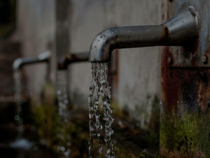A rusty but still functional water faucet still offers a healthy alternative for people who don't want to drink anything else