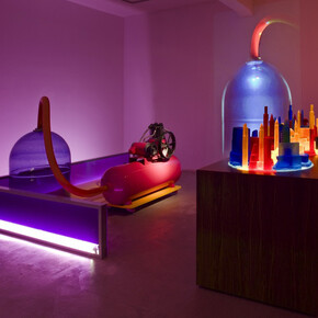 Mike Kelley, Kandor 4, 2007, Mixed media with video projection, Part 1 with bottle: 161.3 x 325.1 x 242.6 cm / 63 1/2 x 128 x 95 1/2 in, Part 2 with cities: 142.2 x 265.7 x 95.3 cm / 56 x 104 5/8 x 37 1/2 in, Overall dimensions variable, © Mike Kelley Foundation for the Arts.  All Rights Reserved/Licensed by VAGA, New York, Courtesy the artist and Hauser & Wirth, Photo: Fredrik Nilsen

