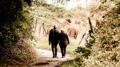 An elderly couple having a discussion about the challenges they're facing in this stage of their life