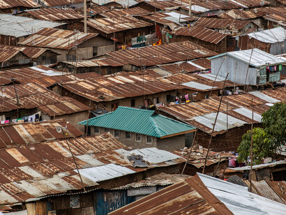 An aerial view of the dense settlement in Kibera, a slum in Nairobi, Kenya, highlights the ongoing need for grassroots mobilisation and effective responses to the housing crisis