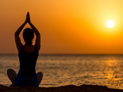 A person welcoming the first light of day through mindful practice, reflecting clarity, renewal, and presence