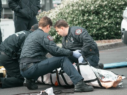 Firefighters practicing on dummy health and safety measures as part of their training to keep the peace