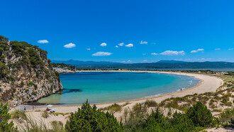 The blue Mediterranean bay of the Peloponnese in Greece is the perfect summer beach destination