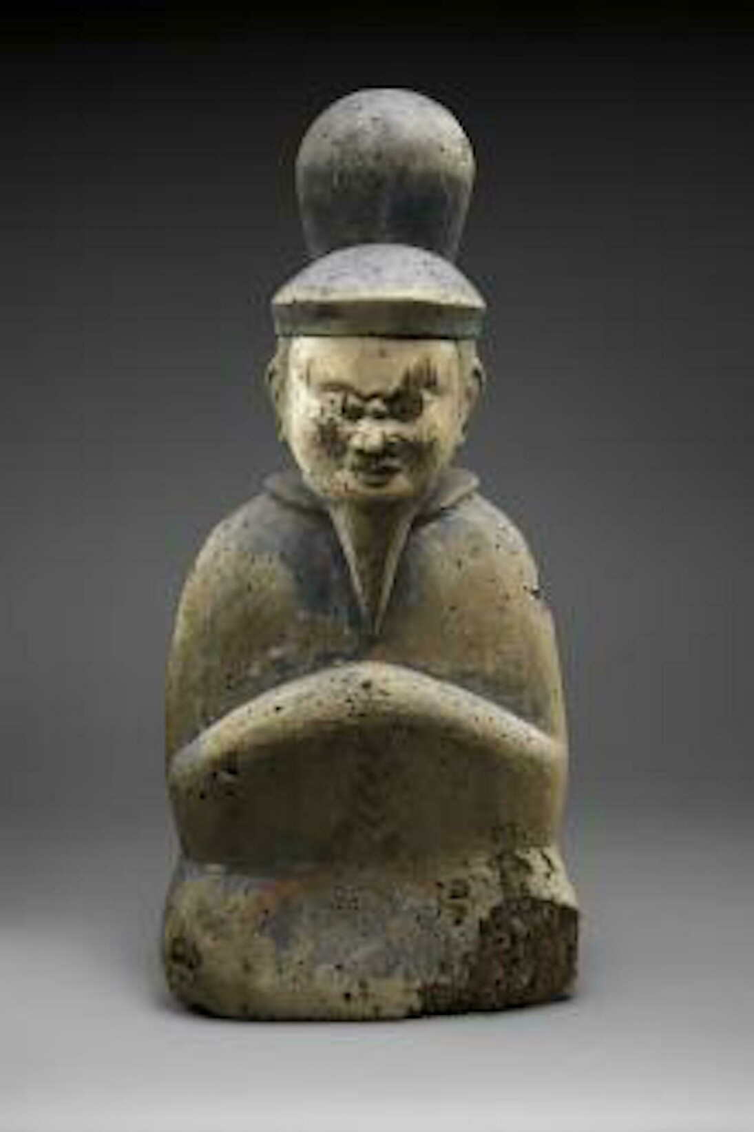 Shinto deity as a seated courtier, Japan, Heian period (794–1185), 11th–12th century, Wood; single-block (ichiboku-zukuri) construction, with traces of red and black pigment, H. 18 in. (45.7 cm); W. 8 3/8 in. (21.3 cm); D. 5 in. (12.7 cm). The Metropolitan Museum of Art, Purchase, Friends of Asian Art Gifts, 2015