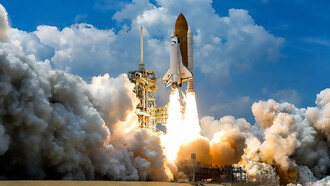 At NASA’s Kennedy Space Center in Florida, space shuttle Atlantis launches through clouds of smoke and steam on its STS-125 mission to service the Hubble Space Telescope. The 11-day mission included five spacewalks to upgrade Hubble with advanced scientific instruments and extend its operational life