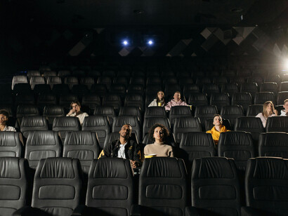 The collective energy of an audience in a darkened theater