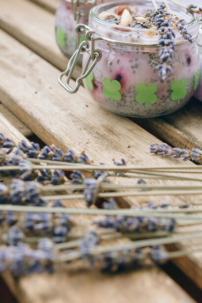 Close-up of chia pudding jars with lavender sprigs, highlighting the textures and colors