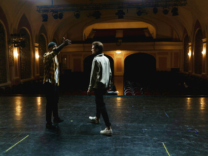 Performers getting ready on stage before the play begins